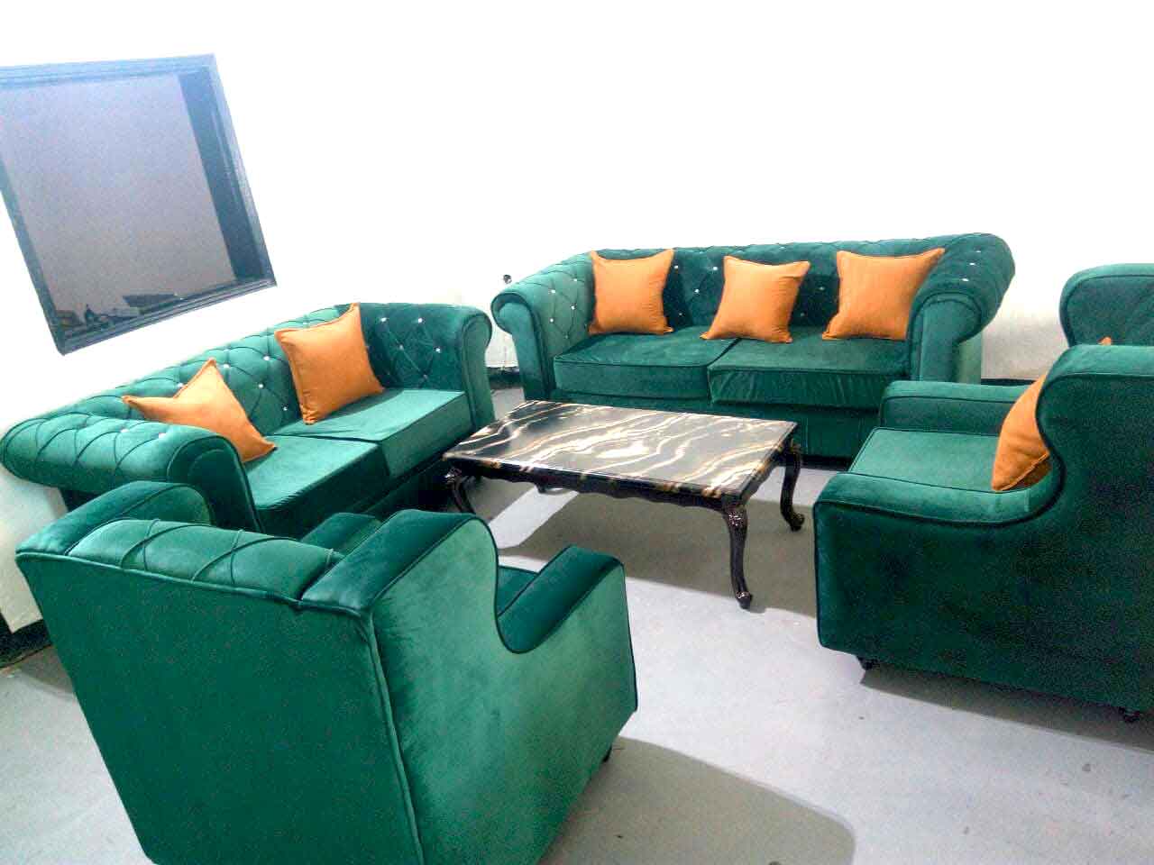 Green-Velvet-Colored-Sofa-with-Yellow-Pillows